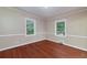 Bedroom featuring hardwood floors, neutral colors, and two windows at 3080 Lynhurst Cir, Atlanta, GA 30311