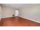 Spacious bedroom with hardwood floors, neutral walls, and ample natural light at 3080 Lynhurst Cir, Atlanta, GA 30311