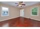 Spacious bedroom features hardwood floors, a ceiling fan, and ample natural light at 3080 Lynhurst Cir, Atlanta, GA 30311