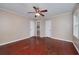 Large bedroom with hardwood floors, ceiling fan and a doorway to the bathroom at 3080 Lynhurst Cir, Atlanta, GA 30311
