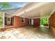 Attached brick carport with entry doors and a solid roof provides ample parking and shelter at 3080 Lynhurst Cir, Atlanta, GA 30311