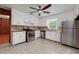Bright kitchen with stainless steel appliances, white cabinets, and tiled floor at 3080 Lynhurst Cir, Atlanta, GA 30311