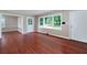 Bright living room featuring gleaming hardwood floors, large windows, and neutral paint at 3080 Lynhurst Cir, Atlanta, GA 30311