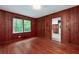 Wood paneled living room with a window and access to the kitchen at 3080 Lynhurst Cir, Atlanta, GA 30311