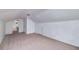 View of large room with neutral carpet and white walls, adjacent to hallway at 3080 Lynhurst Cir, Atlanta, GA 30311