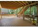 Wooden deck with stairs to yard, railing, table and plants at 4525 Cavallon Nw Way, Acworth, GA 30101