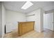 Finished basement with a small bar area, tile floor, and white refrigerator at 4525 Cavallon Nw Way, Acworth, GA 30101