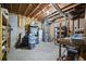 Unfinished basement with exposed ceiling, shelving, and water heater at 4525 Cavallon Nw Way, Acworth, GA 30101