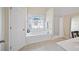 Bright bathroom with decorative window above soaking tub and separate shower at 4525 Cavallon Nw Way, Acworth, GA 30101