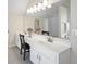 Bathroom with double sink vanity, modern fixtures and large mirror at 4525 Cavallon Nw Way, Acworth, GA 30101