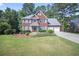 Charming two-story brick home with a manicured lawn and two-car garage at 4525 Cavallon Nw Way, Acworth, GA 30101