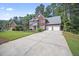 Beautiful two-story brick home with a long driveway and attached two-car garage at 4525 Cavallon Nw Way, Acworth, GA 30101