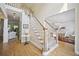 Elegant foyer with hardwood floors and a staircase leading to the upper level at 4525 Cavallon Nw Way, Acworth, GA 30101