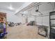 Spacious three car garage with shelving and side entrance to backyard at 4525 Cavallon Nw Way, Acworth, GA 30101