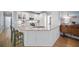 Bright kitchen with white cabinets, stainless steel appliances, and a granite-topped island at 4525 Cavallon Nw Way, Acworth, GA 30101