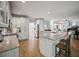 Open-concept kitchen with an island, granite countertops, and views into living room at 4525 Cavallon Nw Way, Acworth, GA 30101