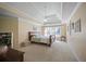 Main bedroom featuring a tray ceiling, large window, and neutral decor at 4525 Cavallon Nw Way, Acworth, GA 30101