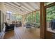 Cozy screened porch with ceiling fan and stylish outdoor furniture at 4525 Cavallon Nw Way, Acworth, GA 30101