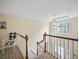 Staircase with hanging light fixture at 4525 Cavallon Nw Way, Acworth, GA 30101