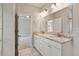 Bathroom with double sink granite vanity, ample lighting, and tile floors at 1463 Edgebrook Ne Ct # 14, Atlanta, GA 30329