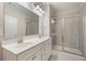 Bathroom boasts double sinks, granite countertop, and a glass enclosed shower at 1463 Edgebrook Ne Ct # 14, Atlanta, GA 30329