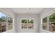 Bright bedroom featuring three large windows offering ample natural light and neighborhood views at 1463 Edgebrook Ne Ct # 14, Atlanta, GA 30329