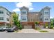Modern townhome exteriors boast a gray color scheme, attached garages, and private outdoor deck spaces at 1463 Edgebrook Ne Ct # 14, Atlanta, GA 30329