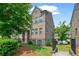 Well maintained townhouse with manicured landscaping and black metal fence surrounding the property at 1463 Edgebrook Ne Ct # 14, Atlanta, GA 30329