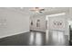 Bright living room with dark hardwood floors, recessed lights, and adjacent sunroom at 1463 Edgebrook Ne Ct # 14, Atlanta, GA 30329