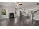 Open concept living space with hardwood floors, fireplace, and modern kitchen in the background at 1463 Edgebrook Ne Ct # 14, Atlanta, GA 30329