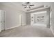 Spacious main bedroom with tray ceiling, recessed lighting, and neutral carpet at 1463 Edgebrook Ne Ct # 14, Atlanta, GA 30329