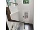 Staircase with dark wood floors and white trim, leading down towards a white door at 1463 Edgebrook Ne Ct # 14, Atlanta, GA 30329