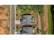 Aerial view of a home with a defined property line highlighting the landscaped yard and outdoor living space at 203 Belmont Park Dr, Canton, GA 30115