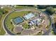 An aerial view of the neighborhood amenities including a resort-style pool, tennis courts, and lush landscaping at 203 Belmont Park Dr, Canton, GA 30115