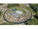 An aerial view of the community center, including a pool, tennis courts, playground, and putting green at 203 Belmont Park Dr, Canton, GA 30115