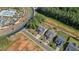 An aerial view showcasing the new construction homes and community amenities, including a pool and bocce ball court at 203 Belmont Park Dr, Canton, GA 30115