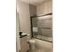 Modern bathroom featuring stylish tile, a glass-enclosed shower, and sleek fixtures at 203 Belmont Park Dr, Canton, GA 30115