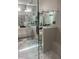 Bright and airy bathroom showcasing a glass-enclosed shower and dual vanities at 203 Belmont Park Dr, Canton, GA 30115