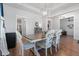 Bright dining room featuring hardwood floors and stylish decor at 203 Belmont Park Dr, Canton, GA 30115