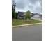 Traditional style home with a well maintained lawn, paved driveway and attached two car garage at 203 Belmont Park Dr, Canton, GA 30115