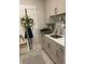 Functional laundry room featuring a sink, ample counter space, and white shaker style cabinets at 203 Belmont Park Dr, Canton, GA 30115