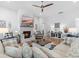Cozy living room with a brick fireplace, ceiling fan, and comfortable seating at 203 Belmont Park Dr, Canton, GA 30115