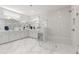 Bright bathroom with double vanity, a frameless shower, and marble floors at 203 Belmont Park Dr, Canton, GA 30115