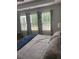 The main bedroom has bright natural light and a comfortable bed at 203 Belmont Park Dr, Canton, GA 30115