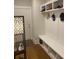 Mudroom featuring custom storage cubbies with a built-in bench, perfect for organizing coats, hats, and shoes at 203 Belmont Park Dr, Canton, GA 30115