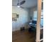 Bright office space with a ceiling fan, natural light, and a dedicated work area at 203 Belmont Park Dr, Canton, GA 30115