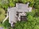 Aerial view showcasing the house's roof featuring solar panels, outdoor living areas, and gorgeous landscaping at 241 Nacoochee Nw Dr, Atlanta, GA 30305
