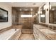 Beautiful bathroom showcasing double sinks, marble countertop and glass shower at 241 Nacoochee Nw Dr, Atlanta, GA 30305