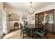 Formal dining area featuring classic furnishings, a chandelier, and hardwood floors at 241 Nacoochee Nw Dr, Atlanta, GA 30305