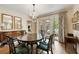 Elegant dining room with chandelier and French doors leading to the patio at 241 Nacoochee Nw Dr, Atlanta, GA 30305